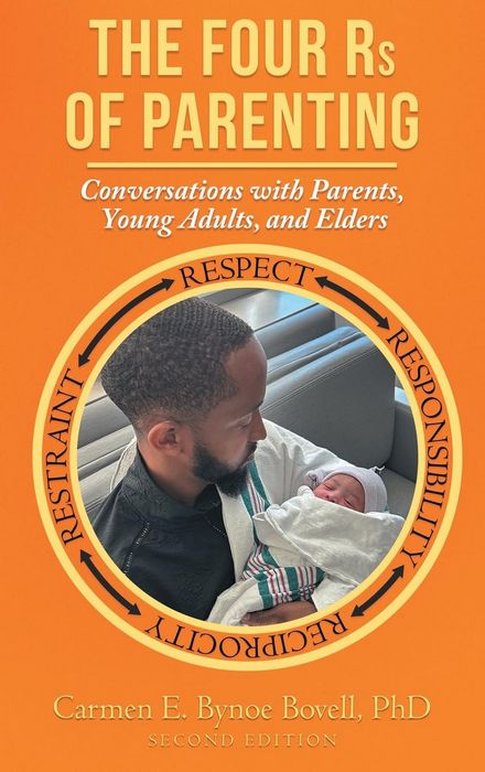 Picture of a new dad holding is new born baby